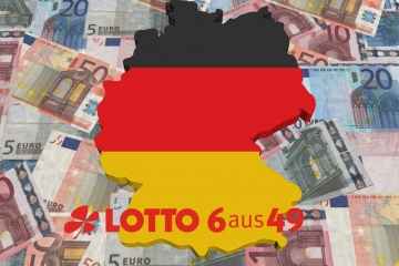 Deutschland in den Farben der Nationalflagge liegt auf Geldscheinen